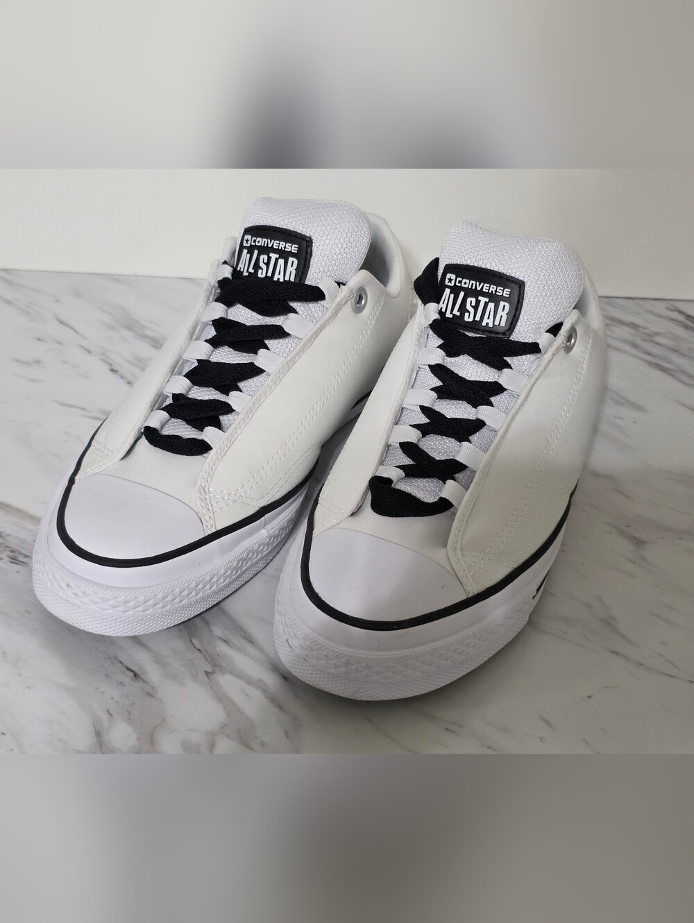 Converse Men’s Low-Top Sneakers in White with Black Details